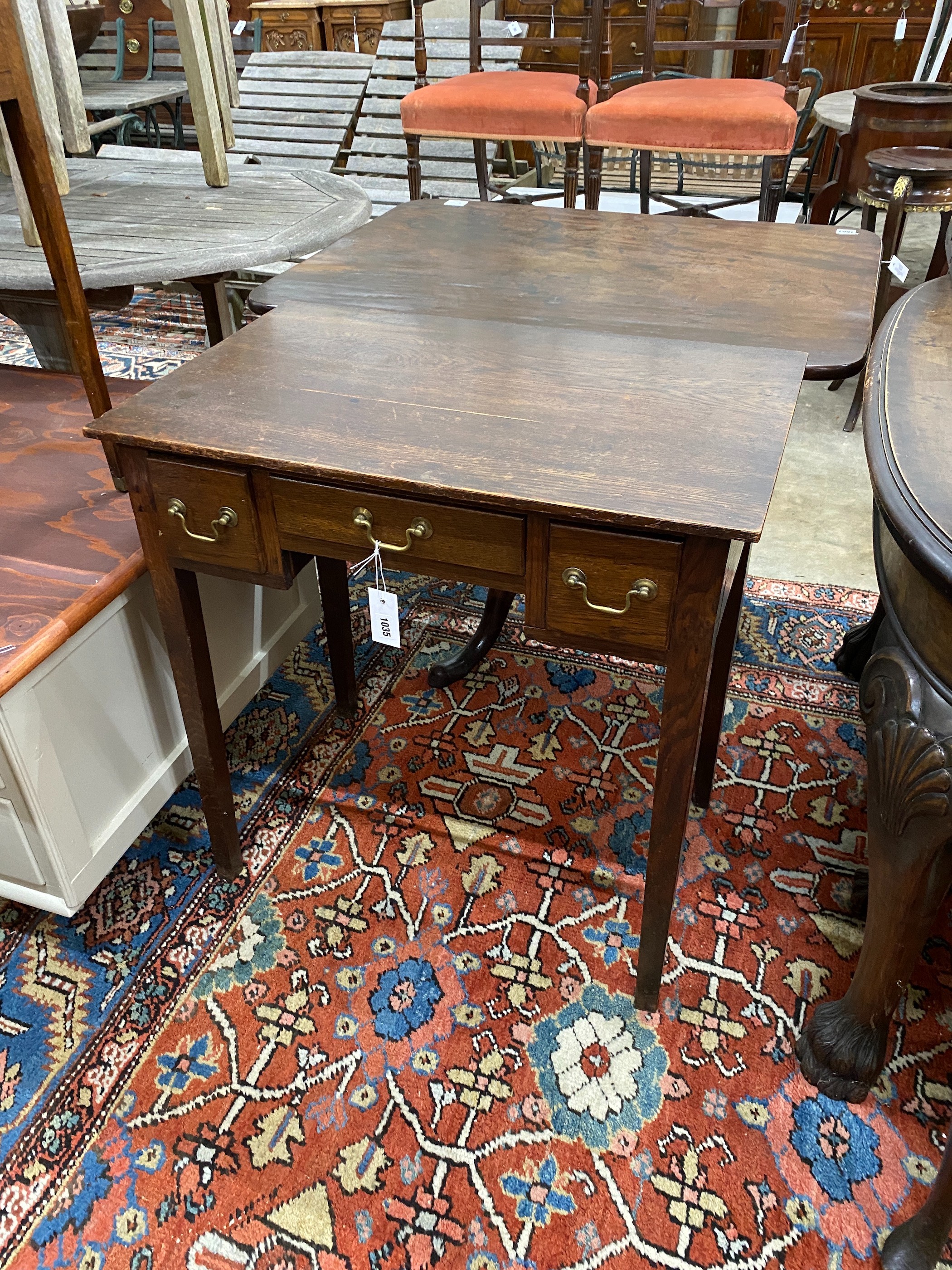 A George III provincial oak lowboy, width 71cm, depth 45cm